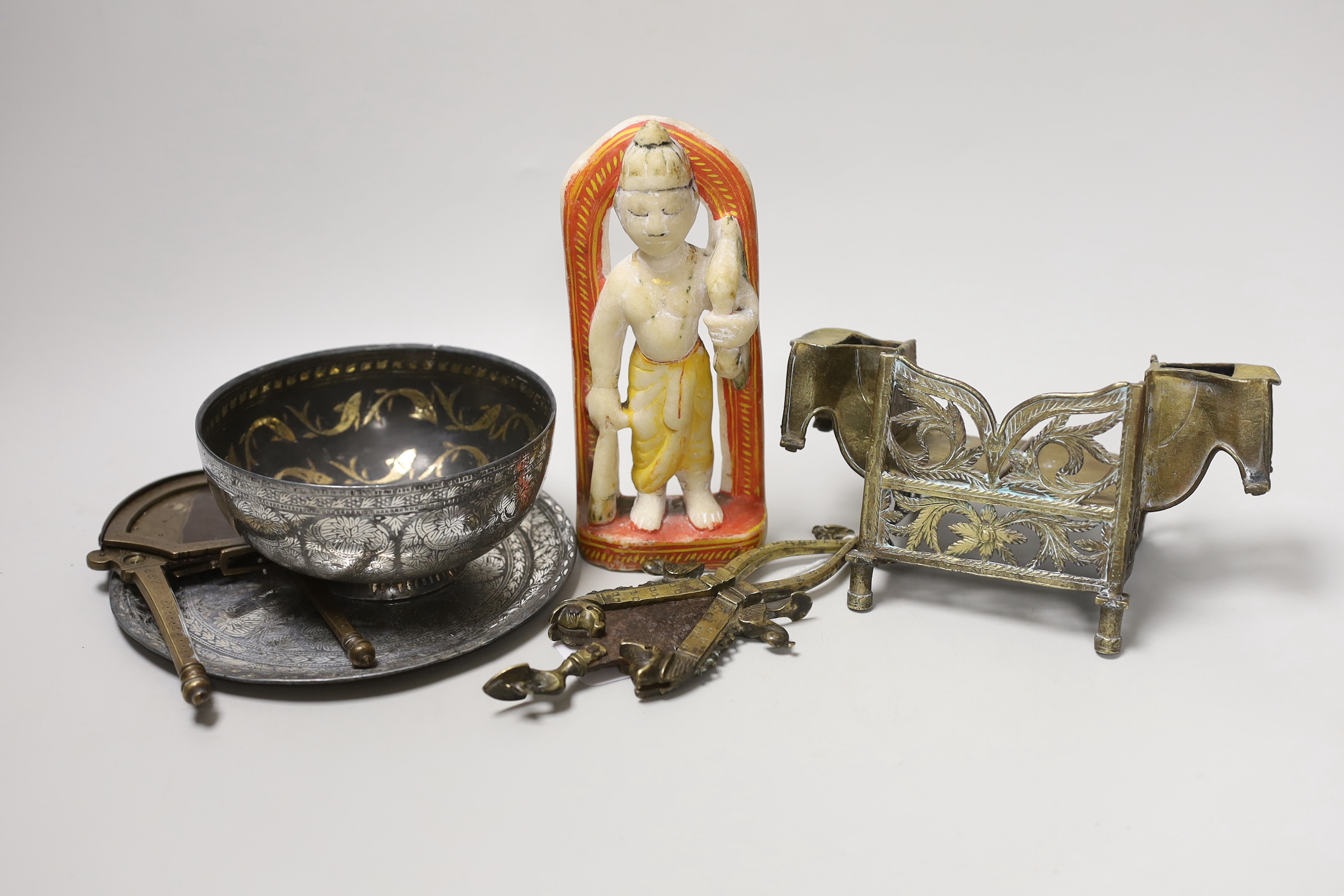 A group of Indian metalware, katar/betel cutters and an alabaster figural carving, 16.5cm (6)